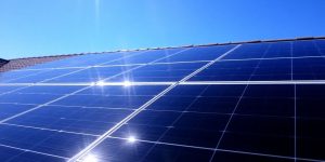 Rooftop solar panels, bright sun